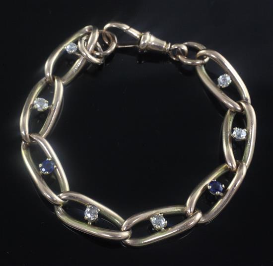 An early 20th century 9ct gold, sapphire and diamond bracelet, 7in.